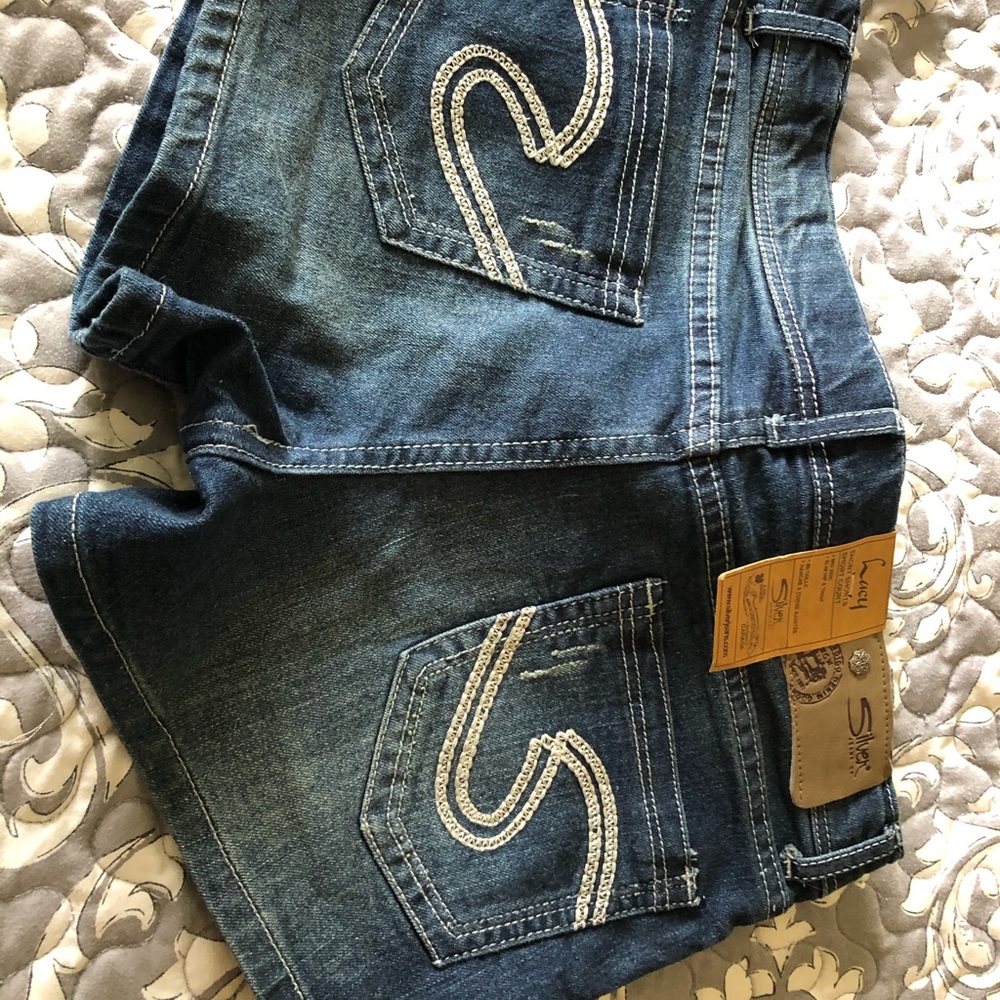 Women’s Silver denim shorts.